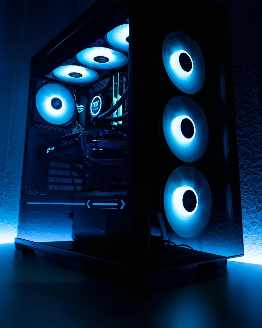 A tempered-glass PC case with glowing blue fans
